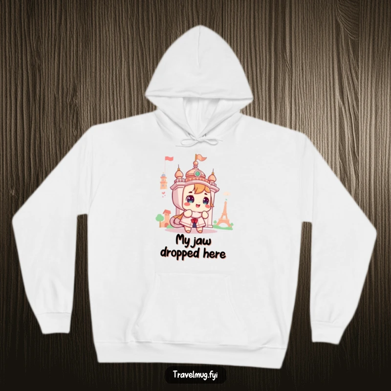 Funny hoodie featuring a cute character looking with awe at a landmark, ideal for cozy travel and inspiring wanderlust.