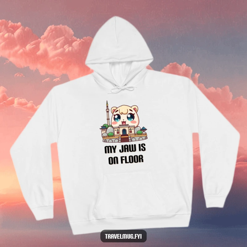 Funny Kawaii character hoodie featuring a cute character with amazed eyes looking at a famous landmark, cozy and inspiring.